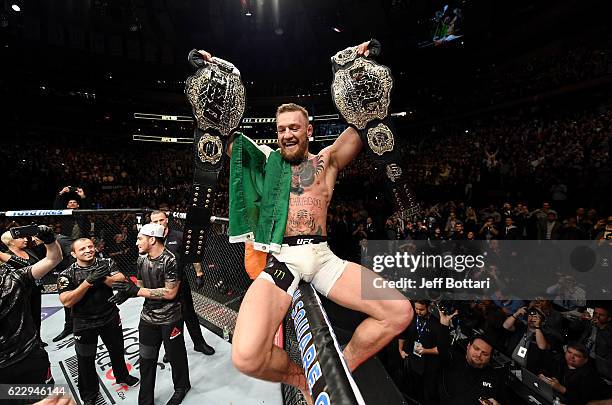 Conor McGregor of Ireland celebrates his KO victory over Eddie Alvarez of the United States in their lightweight championship bout during the UFC 205...