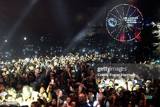 Festival goers watch DJ Mustard perform on Flog Stage during day one of Tyler, the Creator's 5th Annual Camp Flog Gnaw Carnival at Exposition Park on...