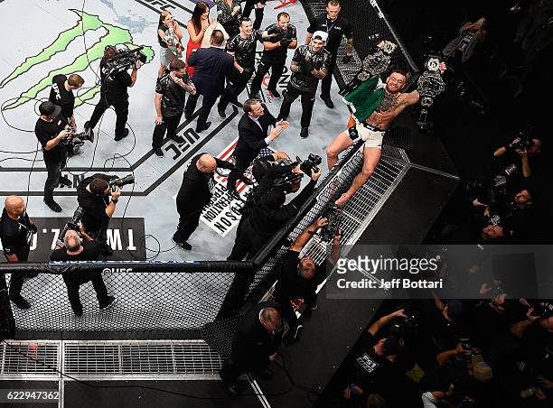 Conor McGregor of Ireland celebrates his KO victory over Eddie Alvarez of the United States in their lightweight championship bout during the UFC 205...