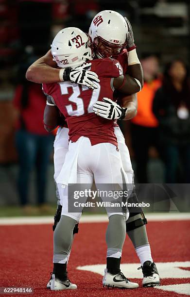 James Williams of the Washington State Cougars celebrates his touchdown in the second half against the California Golden Bears with teammate Andre...