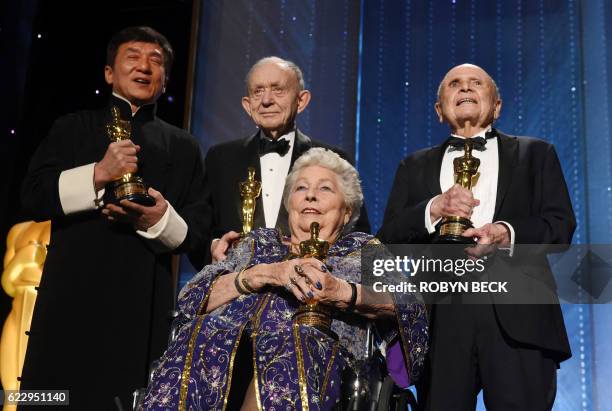 Honorees actor Jackie Chan, documentary filmmaker Frederick Wiseman, film editor Anne V. Coates and casting director Lynn Stalmaster pose with their...