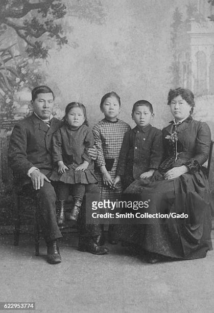 Photographic portrait of the Tape family, including Joseph Tape, Emily Tape, Frank Tape, Mamie Tape, and Mary Tape, 1884. In the California Supreme...