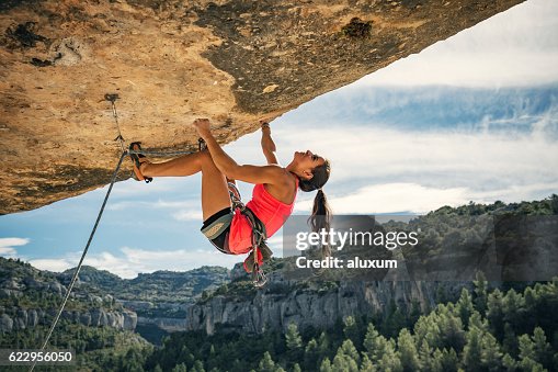 Female rock climber in Margalef Catalonia Spain Female rock climber in Margalef Catalonia Spain