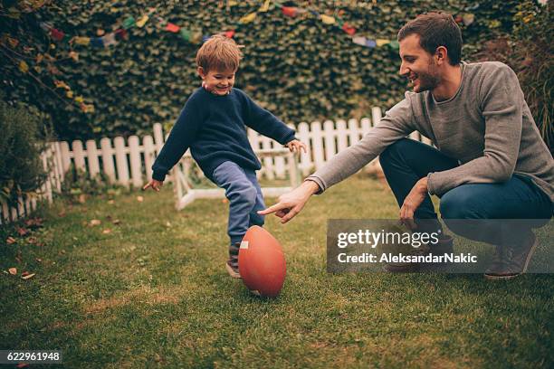 american football with my dad - football season stock pictures, royalty-free photos & images