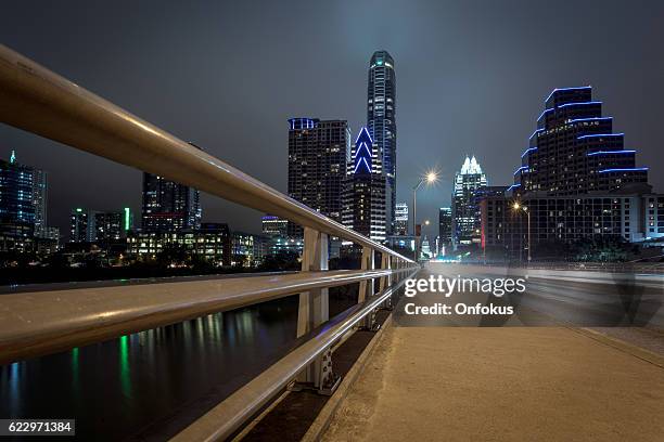 city of austin texas congress avenue at night - austin nightlife stock pictures, royalty-free photos & images