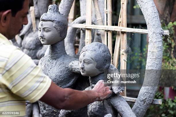 clay sculpture in kumartuli. - durga stock pictures, royalty-free photos & images