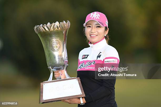 Bo-Mee Lee of South Korea poses with the trophy after winning the Itoen Ladies Golf Tournament 2016 at the Great Island Club on November 13, 2016 in...