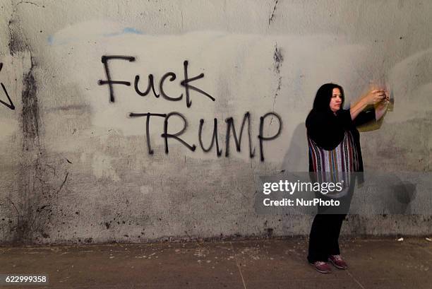 Woman takes a selfie during anti-Trump protest in Los Angeles, California November 12, 2016. According to the LAPD an estimated crowd of nine...