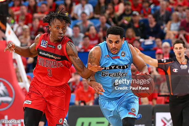 Corey Webster of the Breakers dribbles up the court against Jaron Johnson of the Wildcats during the round six NBL match between the Perth Wildcats...