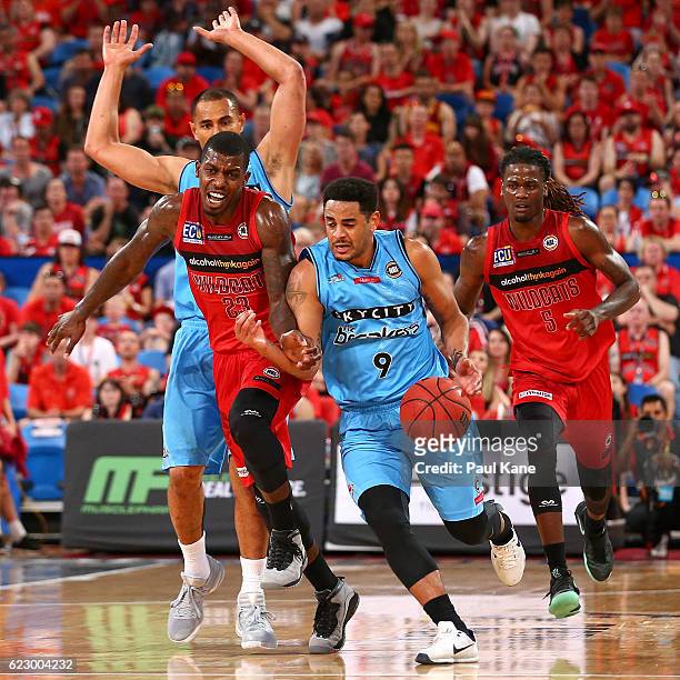 Corey Webster of the Breakers dribbles up the court against Casey Prather of the Wildcats during the round six NBL match between the Perth Wildcats...