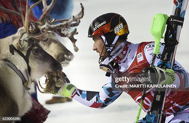 Winner Marcel Hirscher of Austria poses with his trophy, a reindeer which Hirscher named Leo, after the Men's FIS Alpine Skiing World Cup slalom race...