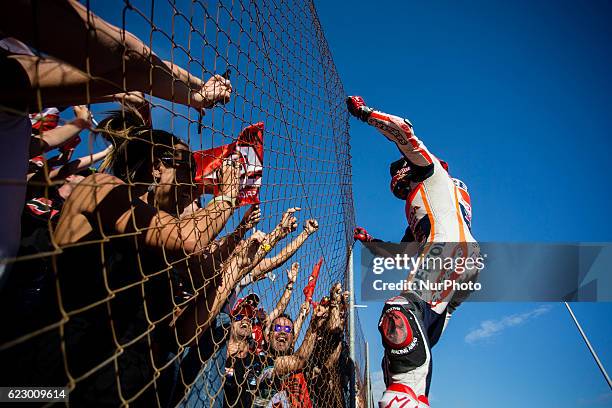 Marc Marquez from Spain of Repsol Honda Team celebrating with his fans during the race of Moto GP Gran Premio Motul de la Comunitat Valenciana at...