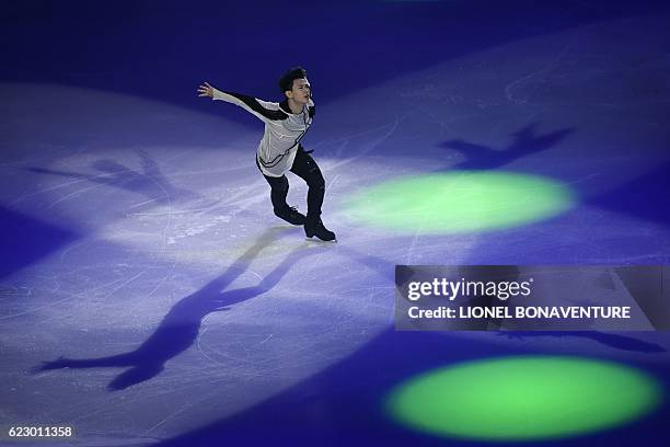 Kazakhstan's Denis Ten performs during the closing ceremony of the ISU Grand Prix of Figure Skating in Paris on November 13, 2016. / AFP / LIONEL...