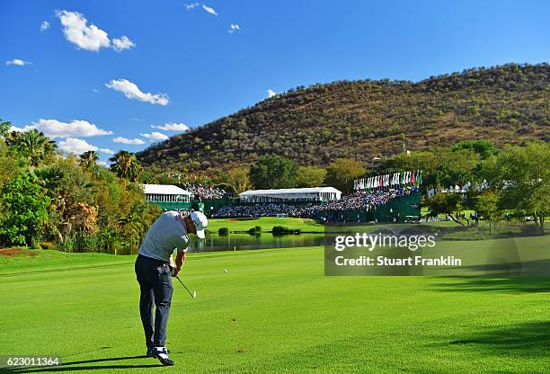 Alex Noren of Sweden plays his approach shot on the 18th hole during the final round of The Nedbank Golf Challenge at Gary Player CC on November 13,...