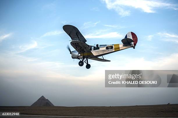 Belgian pilots Alexandra Maingard and her husband Cedric Collette fly their vintage Stampe OO-GWB biplane near the Pyramids of Giza, on the southern...
