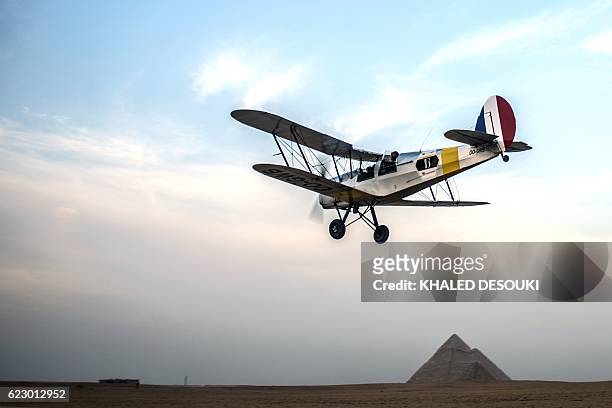 Belgian pilots Alexandra Maingard and her husband Cedric Collette fly their vintage Stampe OO-GWB biplane near the Pyramids of Giza, on the southern...