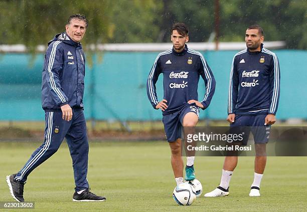 Edgardo Bauza coach of Argentina reacts while Emmanuel Mas and Gabriel Mercado of Argentina look on during a training session at Argentine Football...