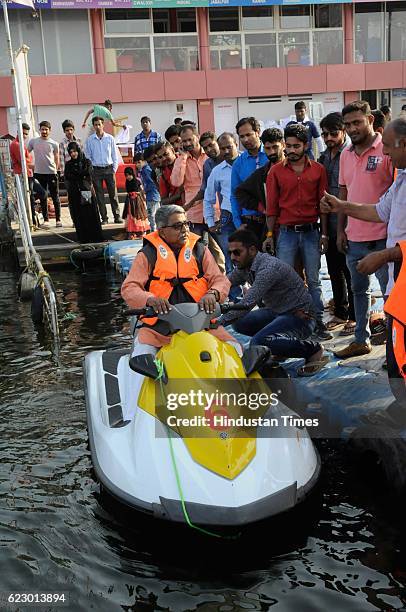 Tapan Bhaumik, Chairman of Madhya Pradesh Tourism Development Corporation , riding a Jet Ski during start of services of a private player at boat...