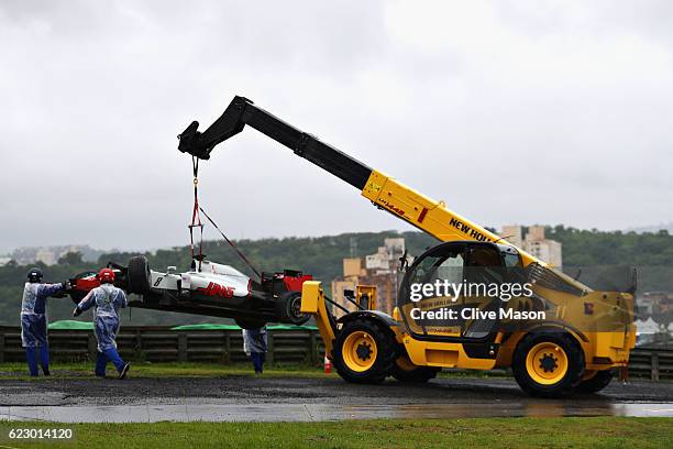 Romain Grosjean of France driving the Haas F1 Team Haas-Ferrari VF-16 Ferrari 059/5 turbo is removed from the circuit after crashing on the parade...