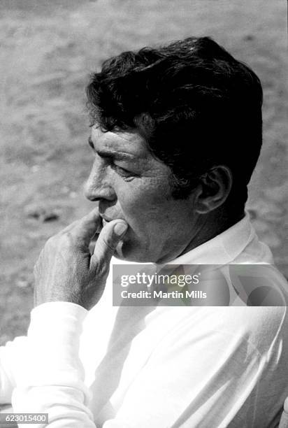 American singer, actor, comedian Dean Martin sits in a chair while on location for "The Ambushers" circa 1967 in Acapulco, Mexico.