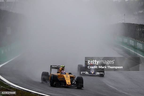 Jolyon Palmer of Great Britain driving the Renault Sport Formula One Team Renault RS16 Renault RE16 turbo leads Felipe Nasr of Brazil driving the...
