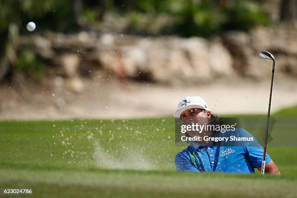 Pat Perez of the United States hits to the sixth green from a greenside bunker during the final round of the OHL Classic at Mayakoba on November 13,...