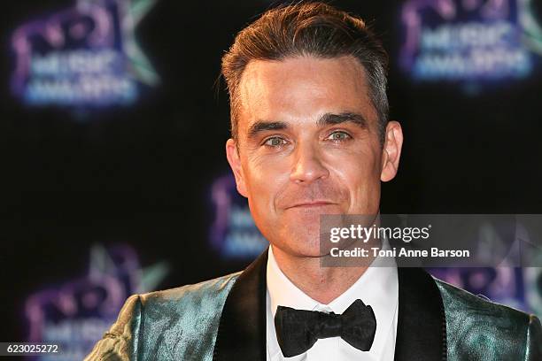 Robbie Williams arrives at the 18th NRJ Music Awards at the Palais des Festivals on November 12, 2016 in Cannes, France.