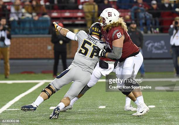 Offensive lineman Cole Madison blocks sophomore defensive end Cameron Saffle in pass protection during the game between the California Golden Bears...