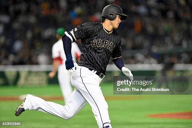 Designated hitter Shohei Ohtani of Japan runs after hitting a double in the first inning during the international friendly match between Mexico and...