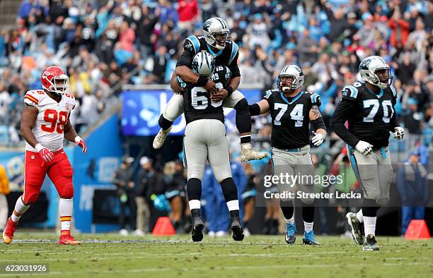 Kendall Reyes of the Kansas City Chiefs watches as Cam Newton reacts after throwing a touchdown pass with teammates Daryl Williams and Mike Remmers...