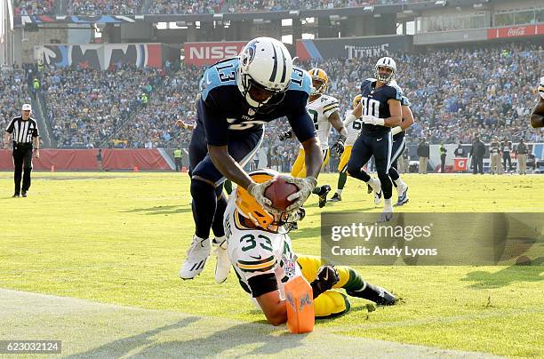 Kendall Wright of the Tennessee Titans scores a touchdown during the game against the Green Bay Packers at Nissan Stadium on November 13, 2016 in...