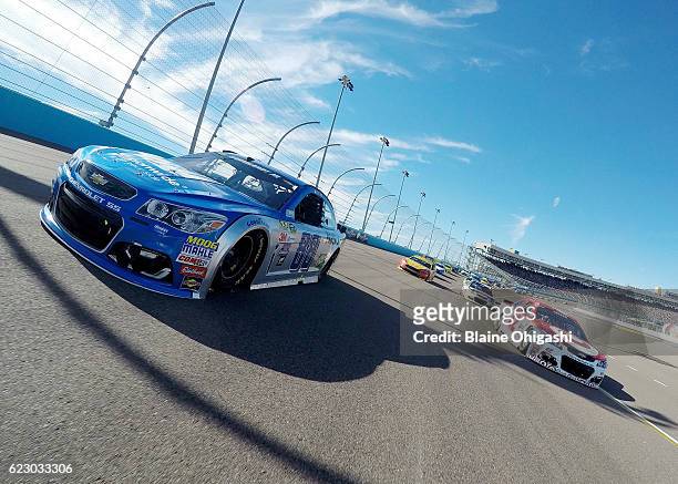 Alex Bowman, driver of the Nationwide Chevrolet, and Kyle Larson, driver of the Target Chevrolet, lead the field during the pace lap prior to the...