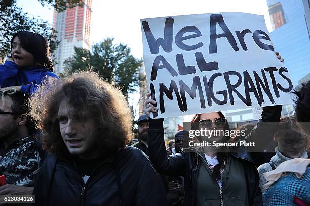 Thousands of anti-Donald Trump protesters, including many pro-immigrant groups, hold a demonstration outside of a Trump property as New Yorkers react...