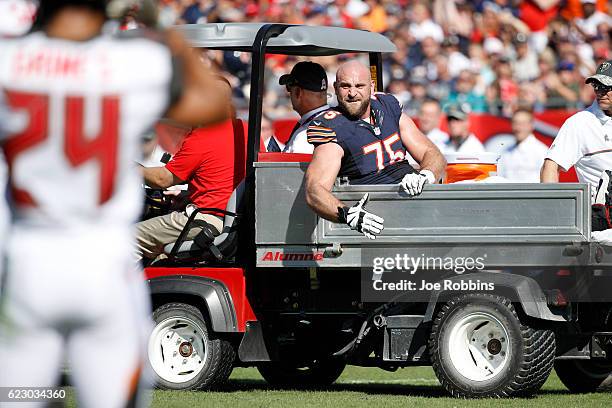 Kyle Long of the Chicago Bears reacts as he is carted off the field following an injury against the Tampa Bay Buccaneers in the first half of the...