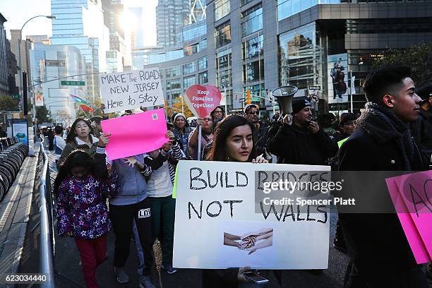 Thousands of anti-Donald Trump protesters, including many pro-immigrant groups, hold a demonstration outside of a Trump property as New Yorkers react...
