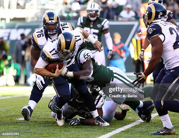 Quarterback Case Keenum of the Los Angeles Rams is sacked by Lorenzo Mauldin of the New York Jets in the second quarter at MetLife Stadium on...