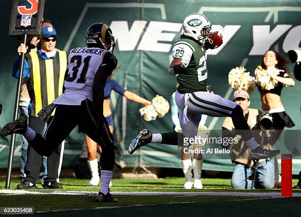 Bilal Powell of the New York Jets scores a touchdown in the first quarter against the Los Angeles Rams at MetLife Stadium on November 13, 2016 in...