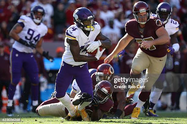 Wide receiver Stefon Diggs of the Minnesota Vikings carries the ball against cornerback Bashaud Breeland of the Washington Redskins in the second...