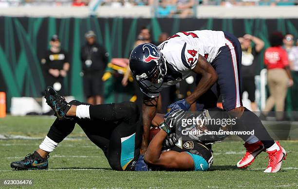 Johnathan Joseph of the Houston Texans tackles Allen Robinson of the Jacksonville Jaguars during the game at EverBank Field on November 13, 2016 in...