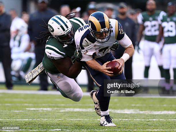 Quarterback Case Keenum of the Los Angeles Rams is sacked by Steve McLendon of the New York Jets in the third quarter at MetLife Stadium on November...