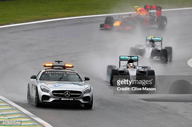The safety car leads Lewis Hamilton of Great Britain driving the Mercedes AMG Petronas F1 Team Mercedes F1 WO7 Mercedes PU106C Hybrid turbo, Nico...