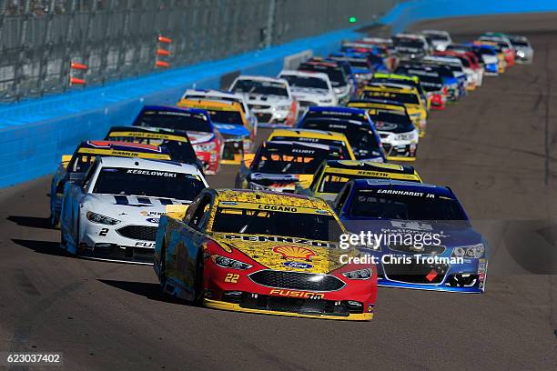 Joey Logano, driver of the Shell Pennzoil Ford, leads the field in a restart during the NASCAR Sprint Cup Series Can-Am 500 at Phoenix International...