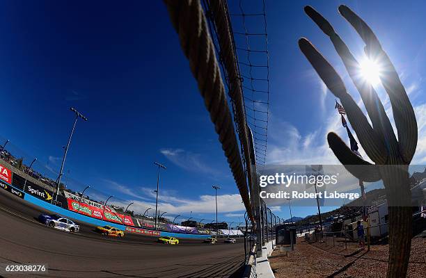 Alex Bowman, driver of the Nationwide Chevrolet, leads Joey Logano, driver of the Shell Pennzoil Ford, during the NASCAR Sprint Cup Series Can-Am 500...