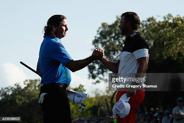Pat Perez of the United States shakes hands with Scott Piercy of the United States after winning the OHL Classic at Mayakoba on November 13, 2016 in...