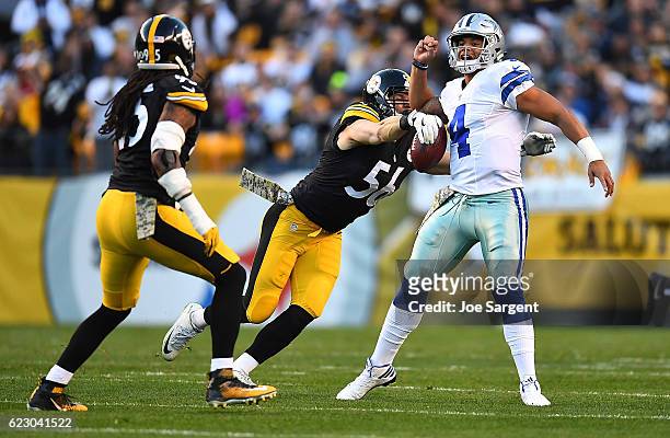 Anthony Chickillo of the Pittsburgh Steelers strips the ball away from quarterback Dak Prescott of the Dallas Cowboys for a fumble in the first...