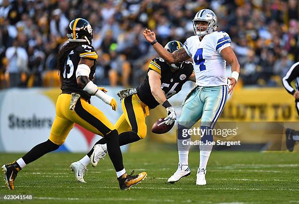 Anthony Chickillo of the Pittsburgh Steelers strips the ball away from Dak Prescott of the Dallas Cowboys for a fumble in the first quarter during...