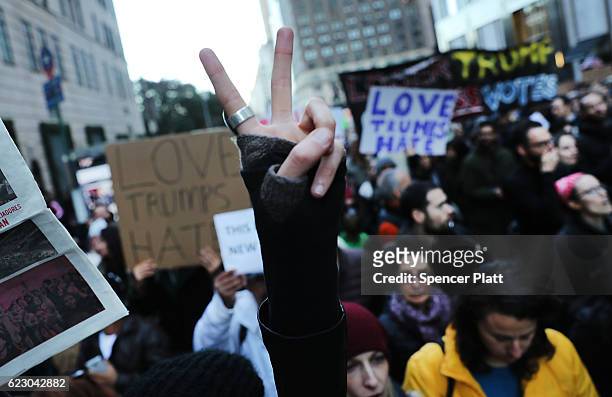 Thousands of anti-Donald Trump protesters, including many pro-immigrant groups, hold a demonstration along 5th Avenue as New Yorkers react to the...