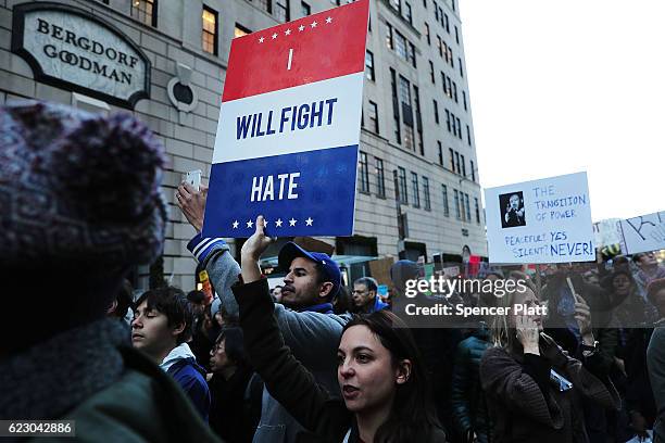 Thousands of anti-Donald Trump protesters, including many pro-immigrant groups, hold a demonstration along 5th Avenue as New Yorkers react to the...