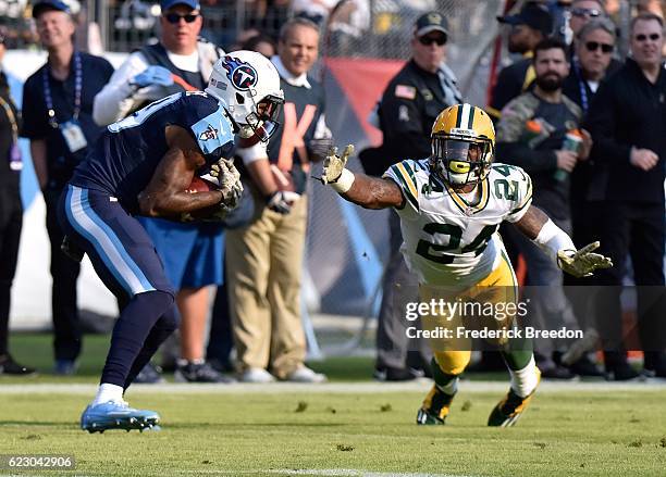 Quinten Rollins of the Green Bay Packers dives to try to break up a touchdown pass to wide receiver Tajae Sharpe of the Tennessee Titans during the...