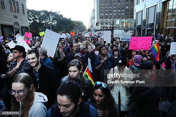 Thousands of anti-Donald Trump protesters, including many pro-immigrant groups, hold a demonstration along 5th Avenue as New Yorkers react to the...